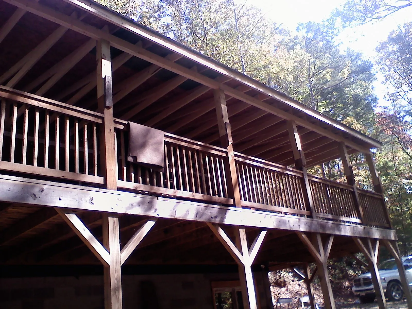 Timber framing under a new elevated porch and deck — Roof Leak Repair in Wolfeboro by Roofing Brothers